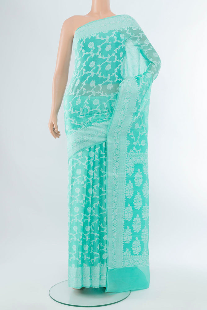 Sky Blue Banarasi Georgette Saree with Jacquard With Thread Butta on the body and Silk Border.  displayed on a mannequin