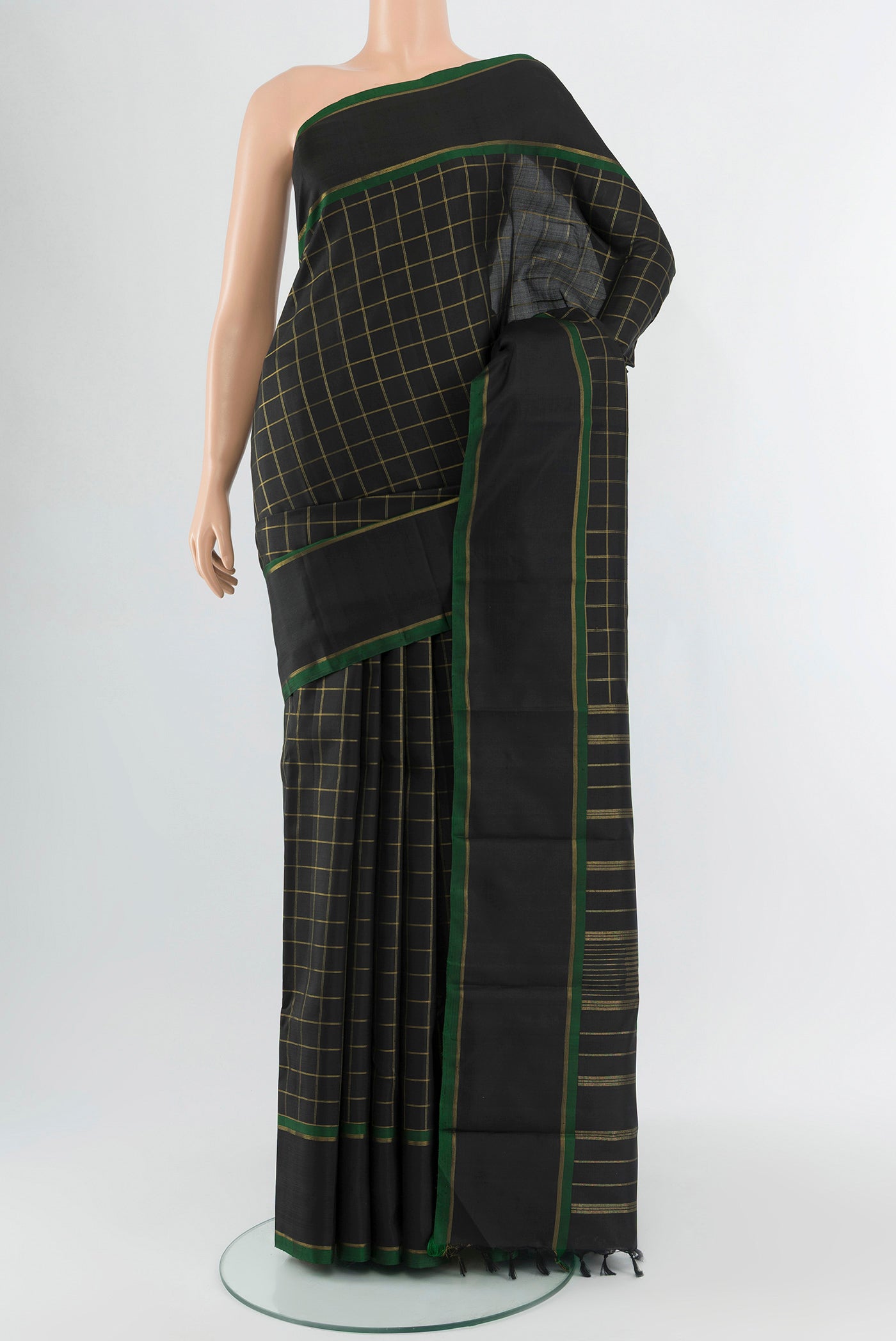 Pure Silk Pure Zari Black Kanchipuram Saree with Checked design on the body and Plain Border.  displayed on a mannequin