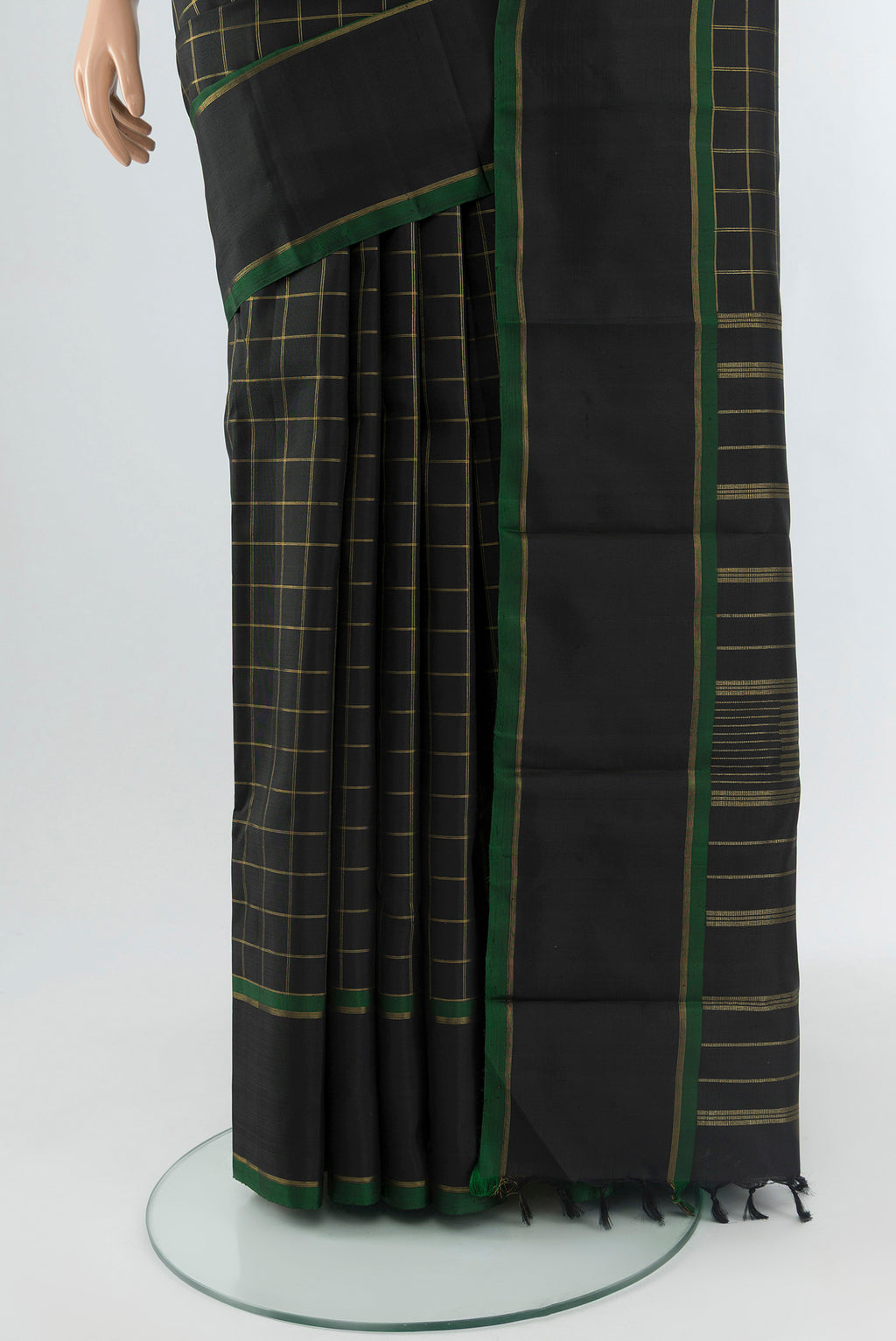Pleats and pallu of Pure Silk Pure Zari Black Kanchipuram Saree with Checked design on the body and Plain Border. 