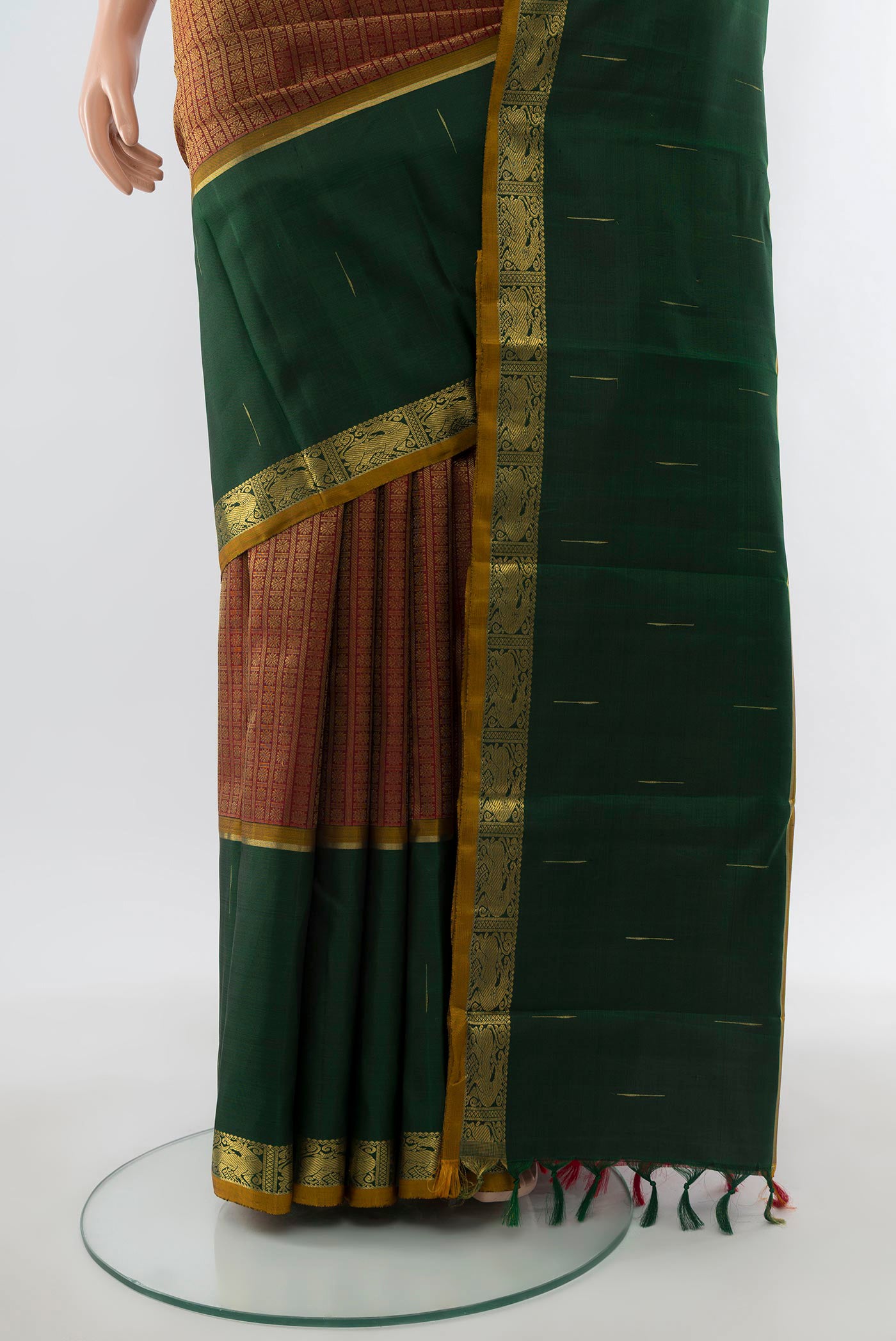 Pleats and pallu of Pure Silk Pure Zari Maroon Kanjivaram Saree with Zari Brocade on the body and Zari Border. 