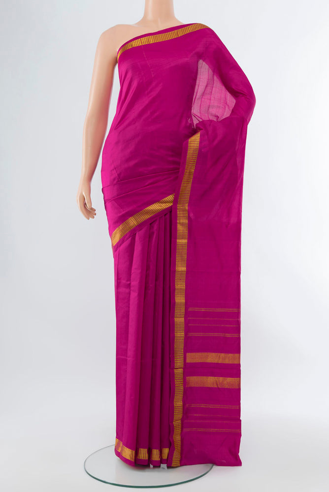Dark Pink Kanjivaram Silk Saree with Plain Body and Silk Border.  displayed on a mannequin