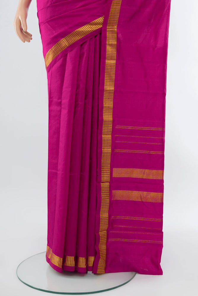 Pleats and pallu of Dark Pink Kanjivaram Silk Saree with Plain Body and Silk Border. 