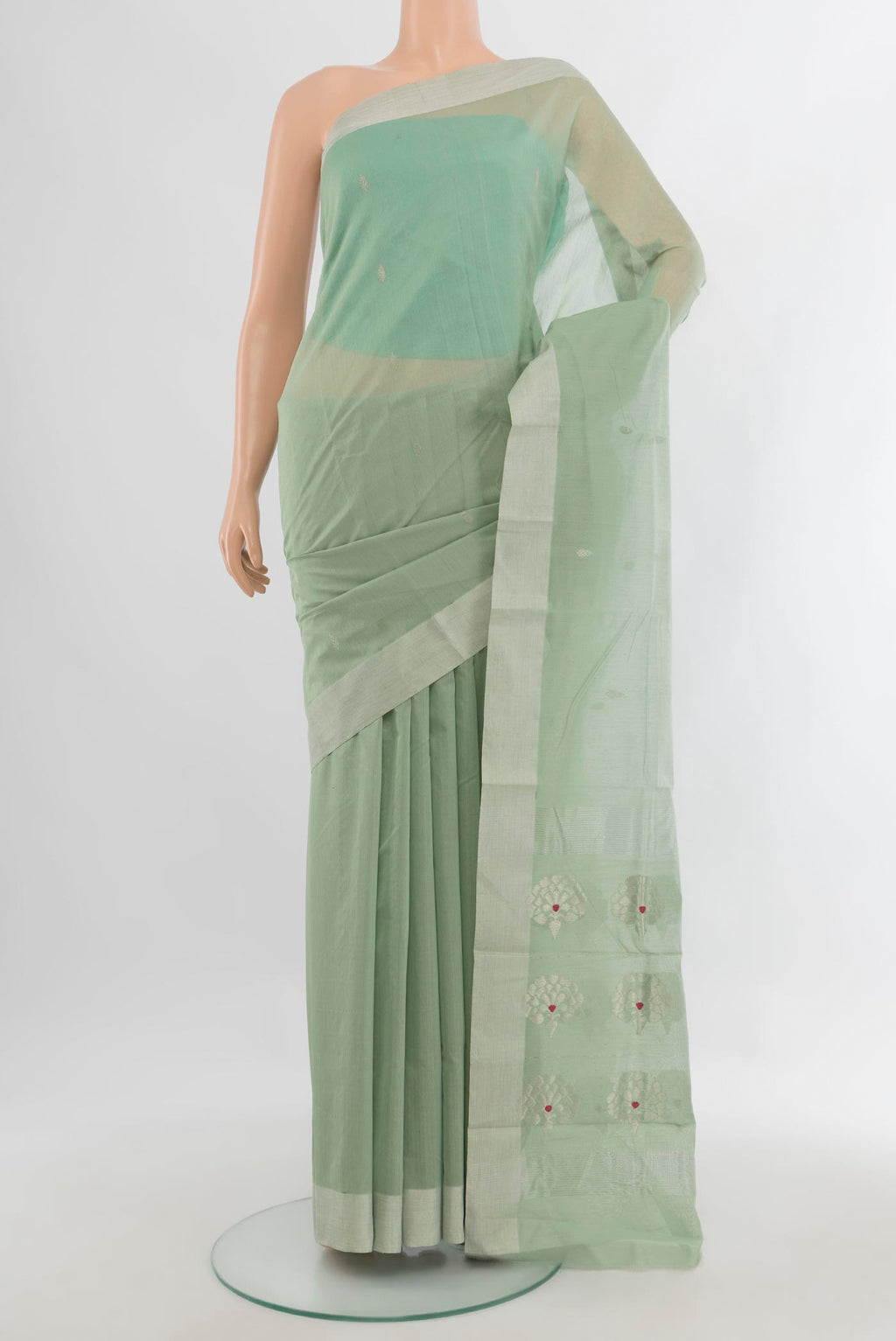 Light Green Chanderi Cotton Saree with Zari Butta on the body and Zari Border.  displayed on a mannequin
