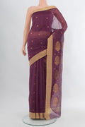 Purple Chanderi Silk Cotton Saree with Zari Butta on the body and Zari Border.  displayed on a mannequin