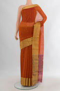 Rust Chanderi Cotton Saree with Zari Butta on the body and Zari Border.  displayed on a mannequin