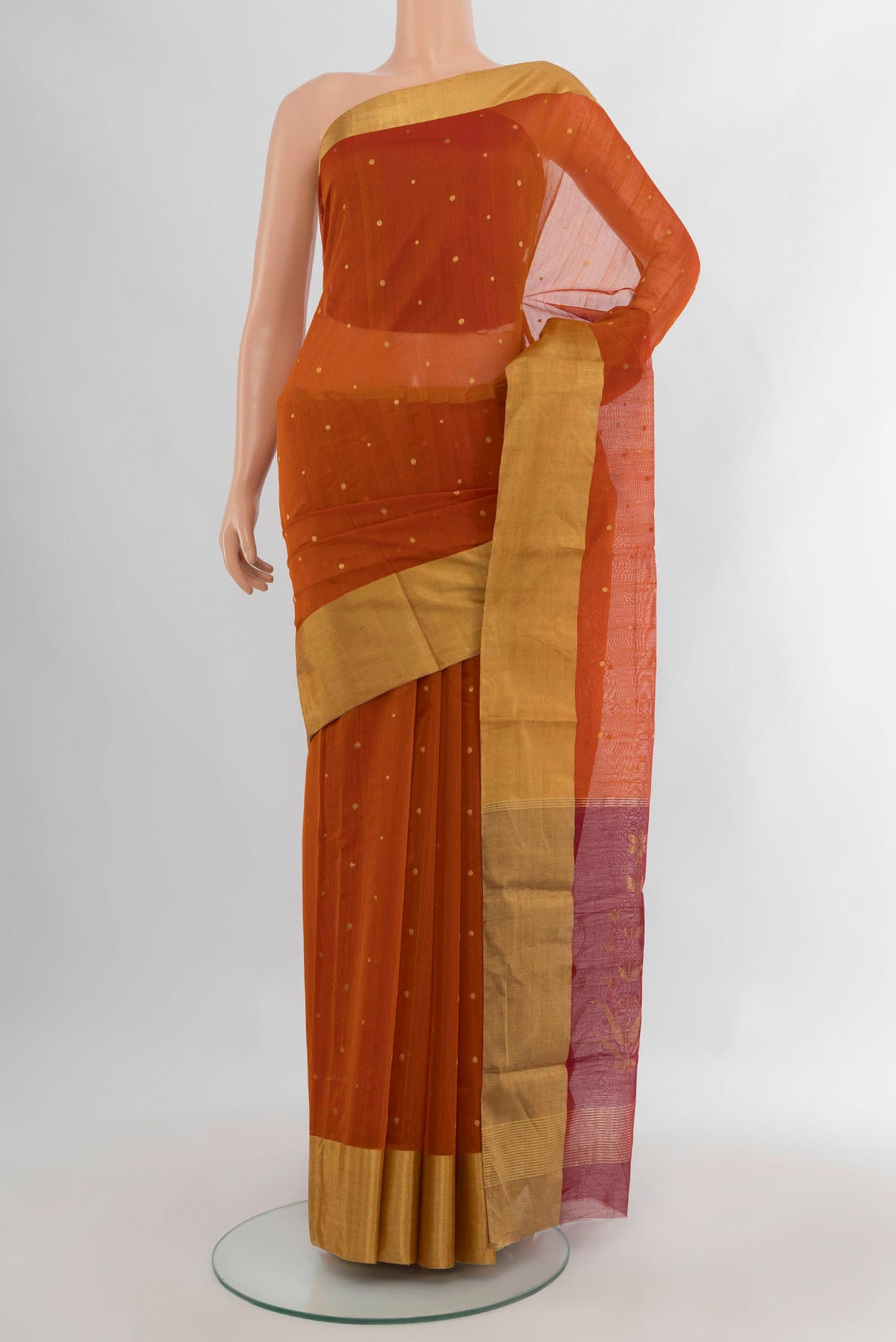 Rust Chanderi Cotton Saree with Zari Butta on the body and Zari Border.  displayed on a mannequin