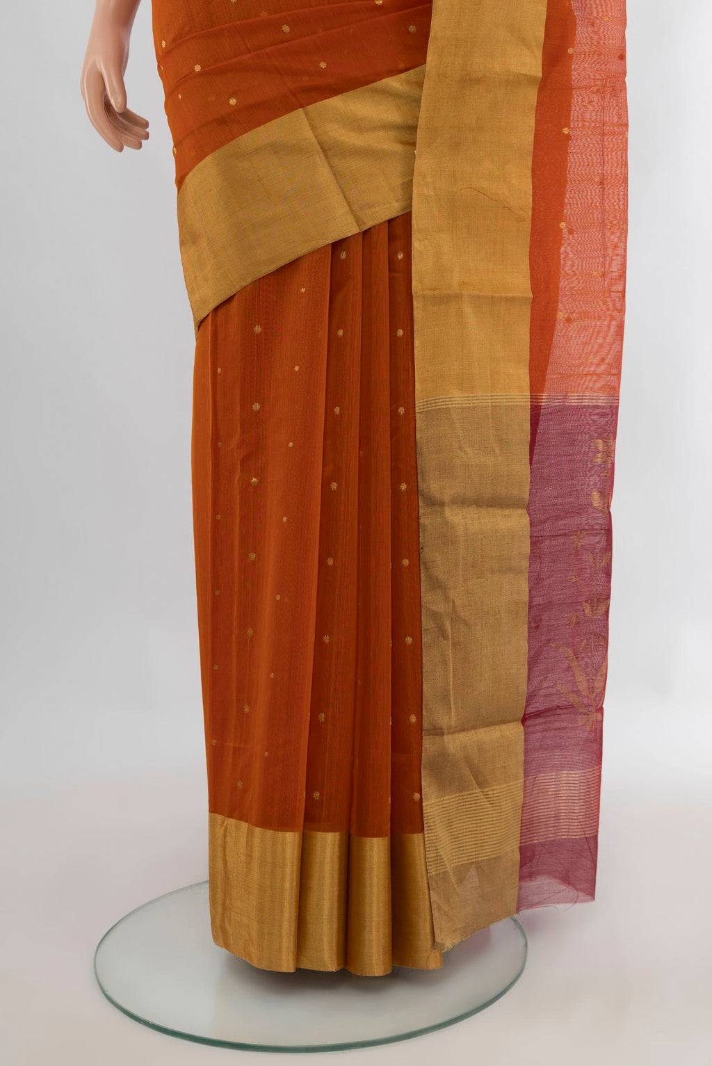 Pleats and pallu of Rust Chanderi Cotton Saree with Zari Butta on the body and Zari Border. 