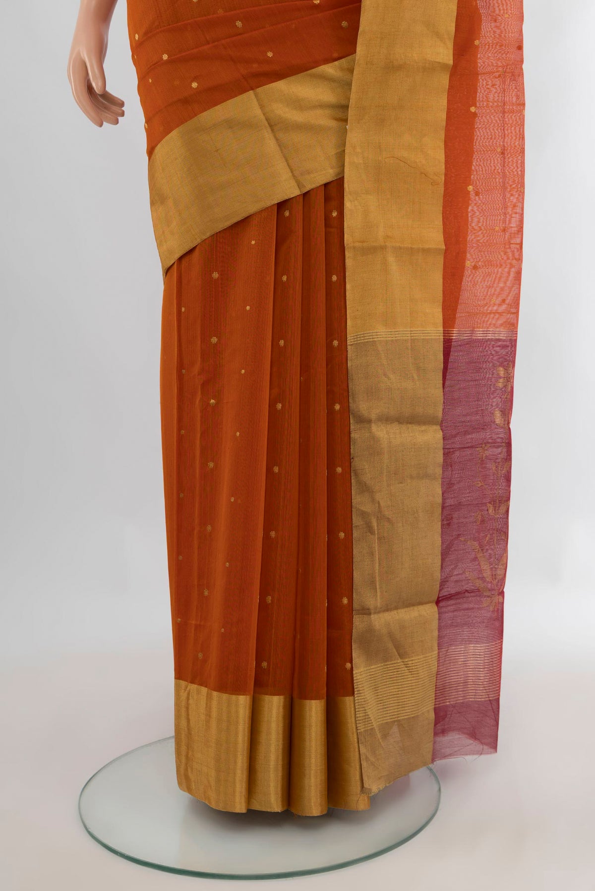 Pleats and pallu of Rust Chanderi Cotton Saree with Zari Butta on the body and Zari Border. 