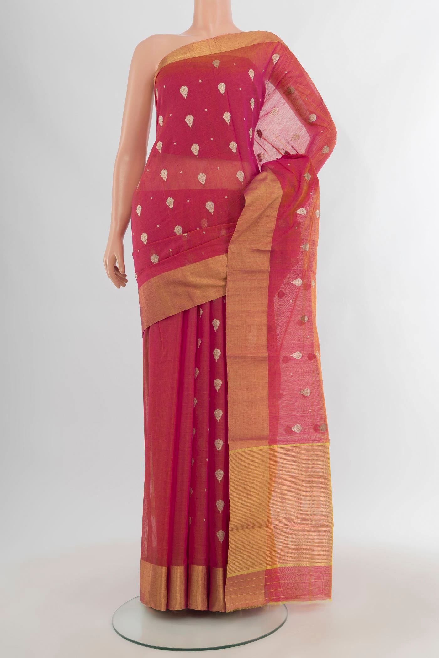 Coral Chanderi Silk Cotton Saree with Zari Butta on the body and Zari Border.  displayed on a mannequin