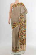 Beige Tussar Silk Saree with Embroidery on the body and Embroidery Border.  displayed on a mannequin