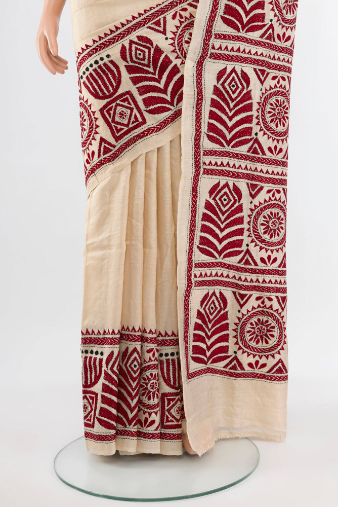 Pleats and pallu of Cream Kantha Silk Saree with Jacquard With Thread Butta on the body and Silk Border. 