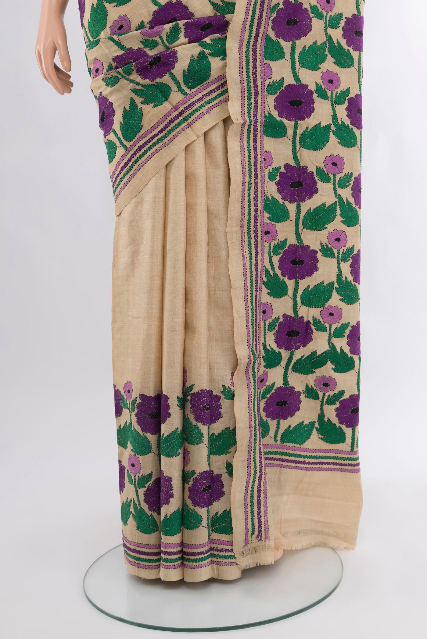 Pleats and pallu of Beige Tussar Silk Saree with Kantha Work on the body and Embroidery Border. 