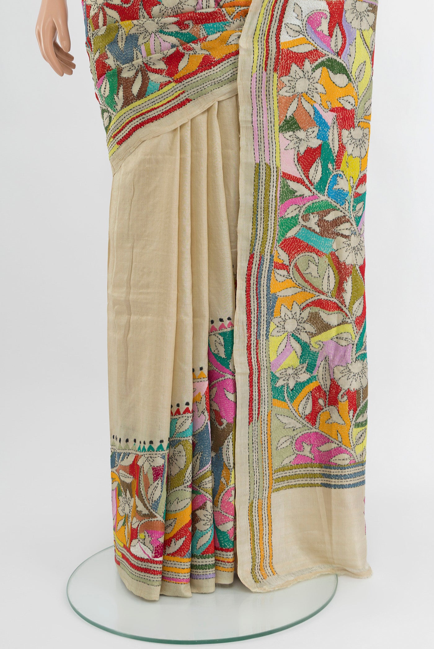 Pleats and pallu of Cream Tussar Silk Saree with Kantha Work on the body and Embroidery Border. 