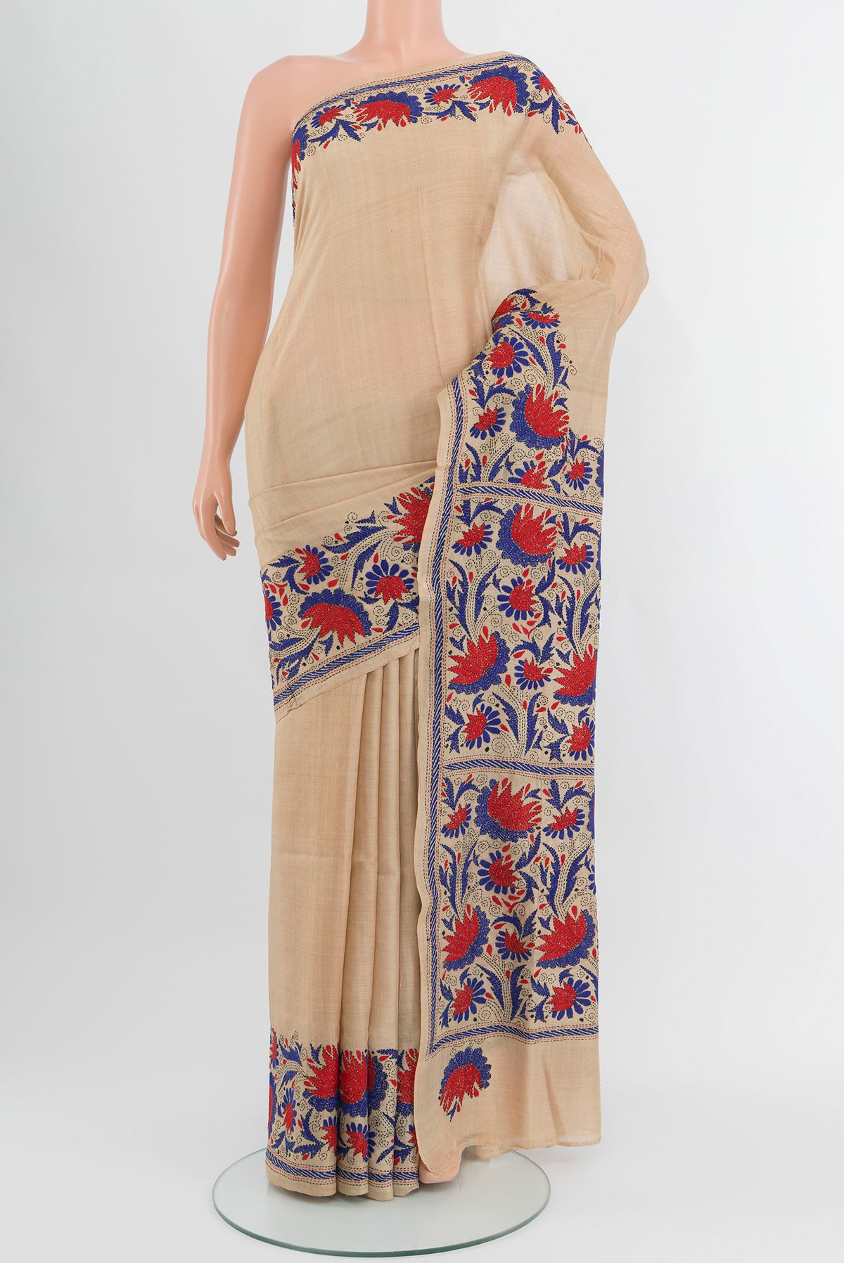 Beige Tussar Silk Saree with Plain Body and Embroidery Border.  displayed on a mannequin