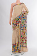 Beige Tussar Silk Saree with Embroidery on the body and Embroidery Border.  displayed on a mannequin