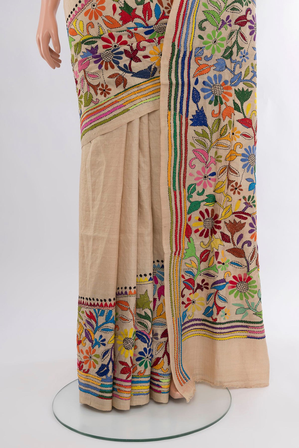 Pleats and pallu of Beige Tussar Silk Saree with Embroidery on the body and Embroidery Border. 