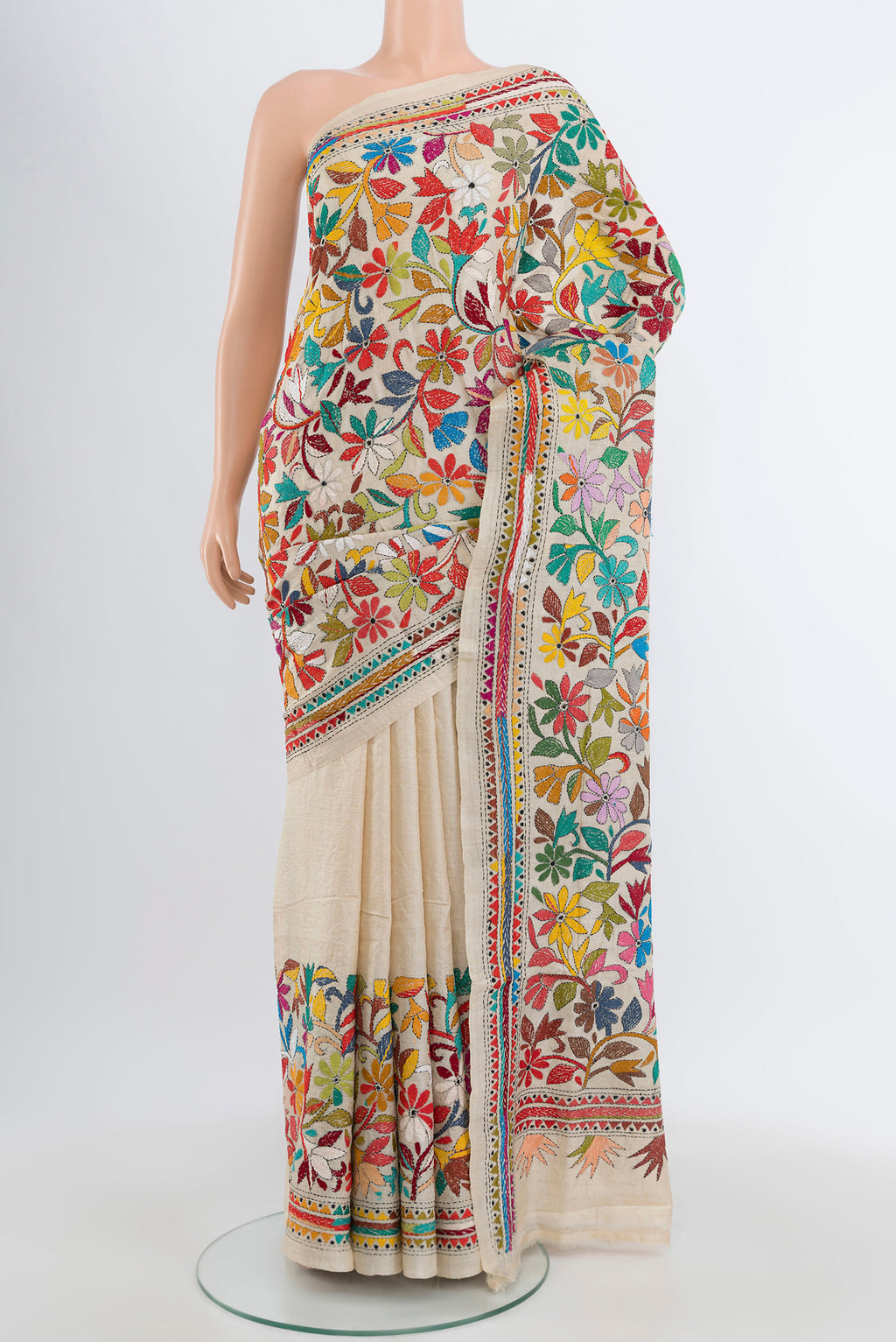 Cream Tussar Silk Saree with Kantha Work on the body and Embroidery Border.  displayed on a mannequin