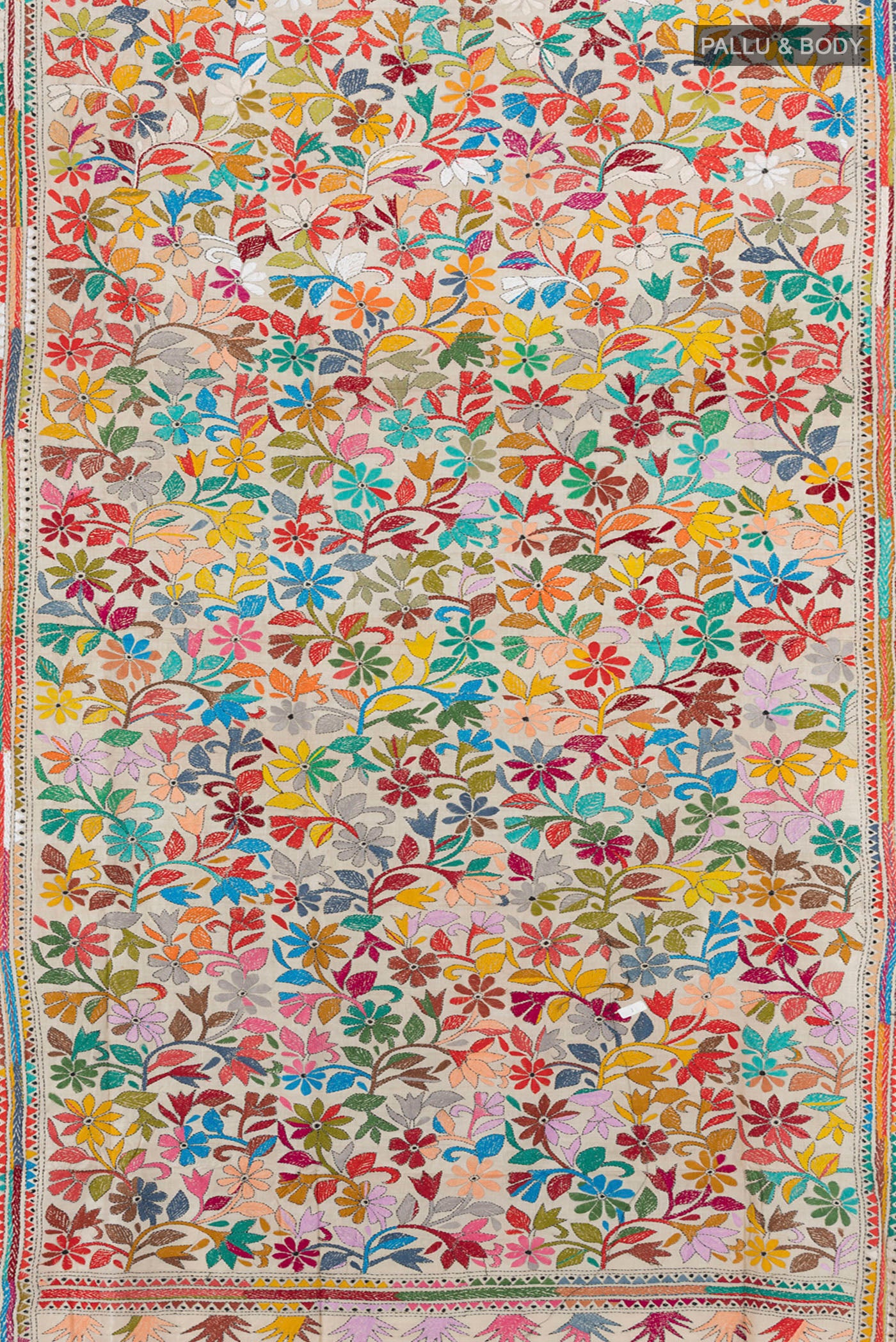 Flat view of Cream Tussar Silk Saree with Kantha Work on the body and Embroidery Border. 