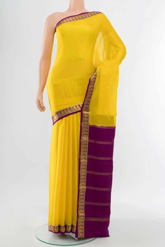 Lemon Yellow Mysore Crepe Saree with Plain Body and Silk Border.  displayed on a mannequin