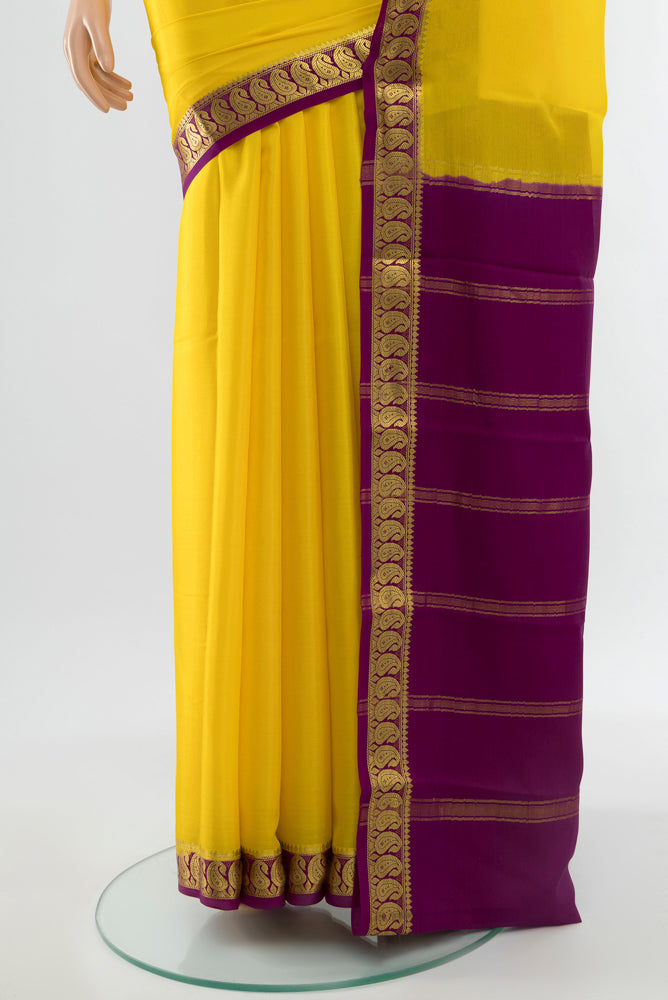 Pleats and pallu of Lemon Yellow Mysore Crepe Saree with Plain Body and Silk Border. 