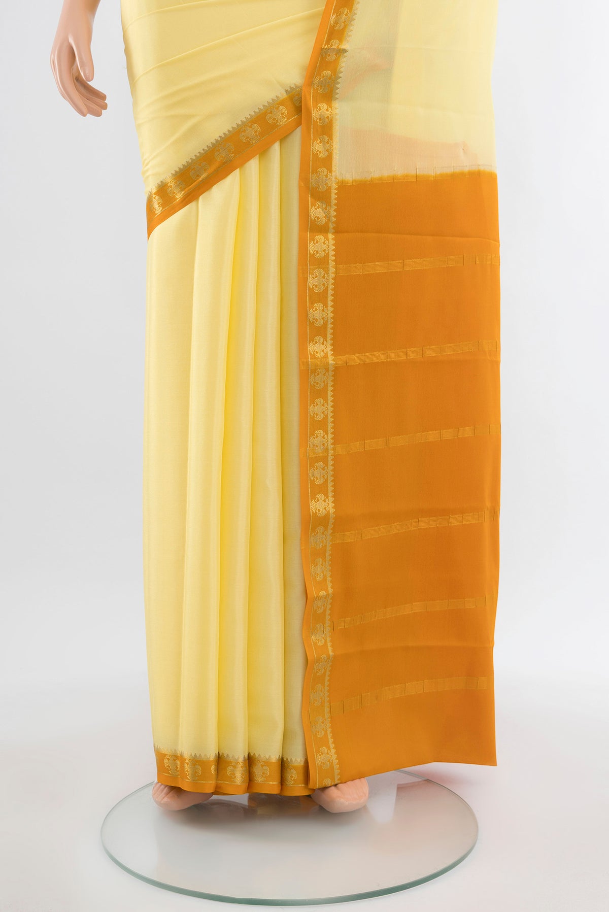 Pleats and pallu of Lemon Yellow Mysore Crepe Saree with Plain Body and Silk Border. 