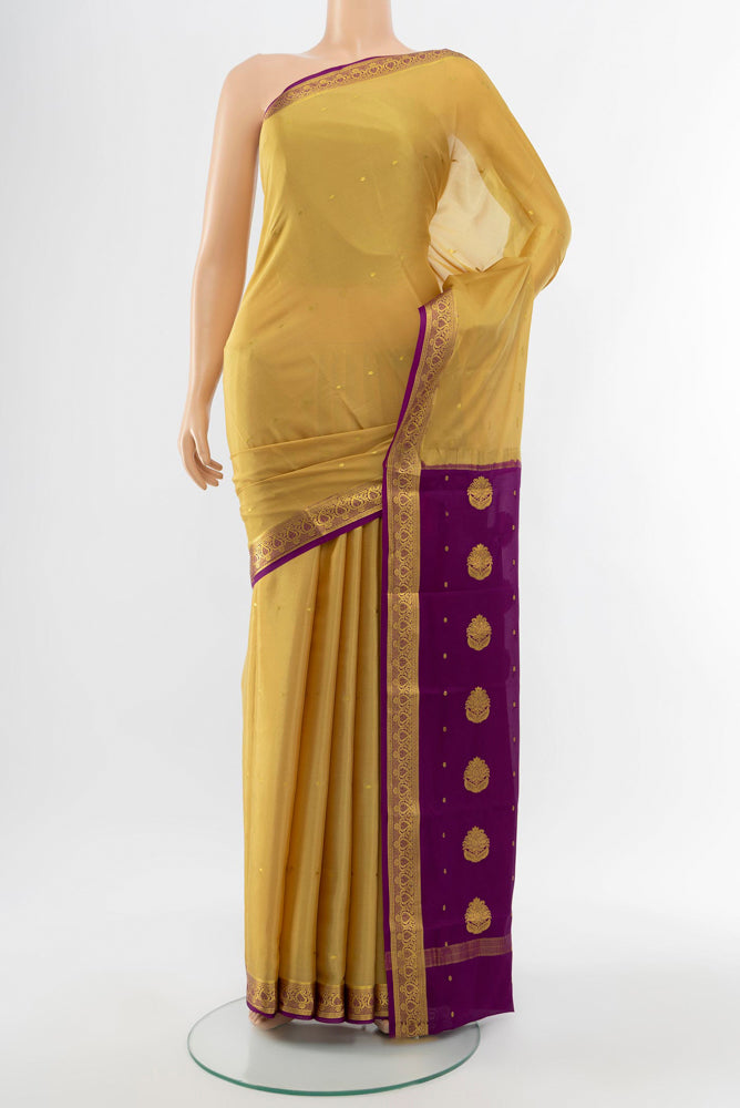 Dark Beige Mysore Crepe Saree with Plain Body and Silk Border.  displayed on a mannequin