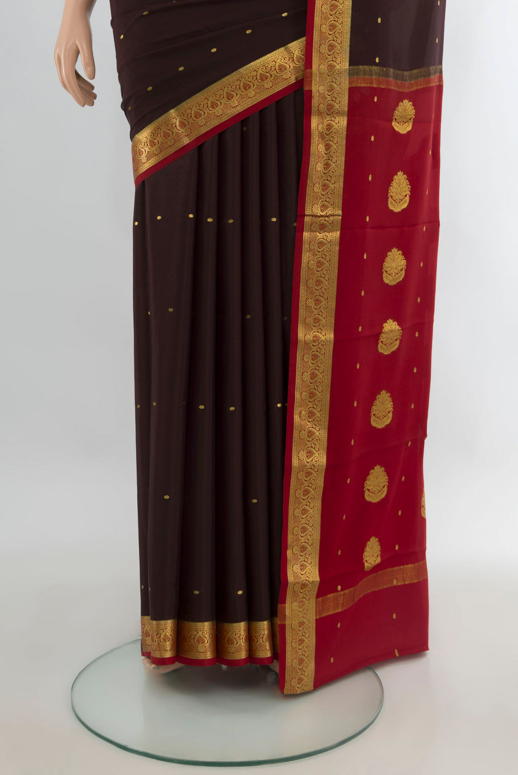 Pleats and pallu of Coffee Brown Mysore Crepe Saree with Zari Butta on the body and Zari Border. 