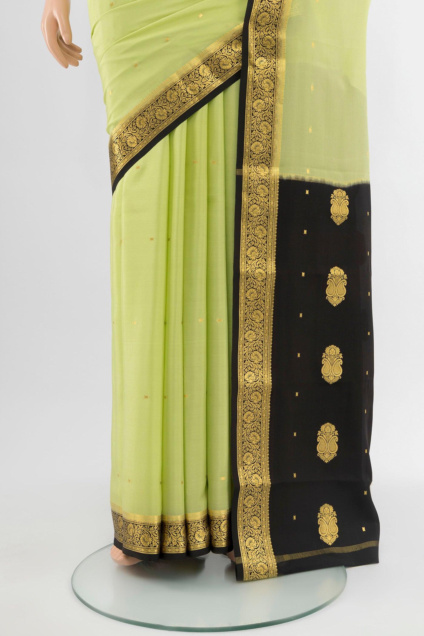 Pleats and pallu of Pista Green Mysore Crepe Saree with Plain Body and Silk Border. 