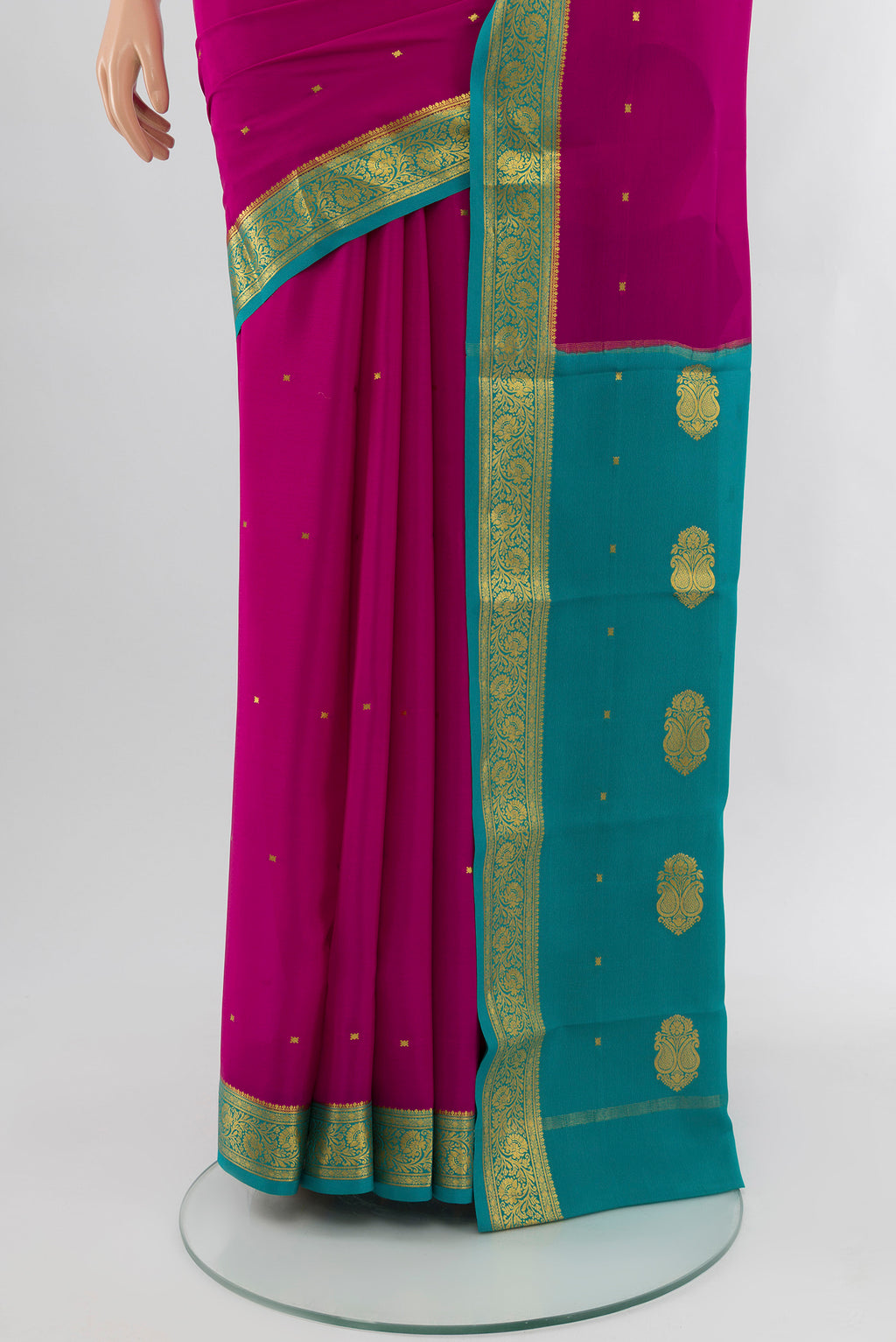 Pleats and pallu of Purple Mysore Crepe Saree with Zari Butta on the body and Silk Border. 