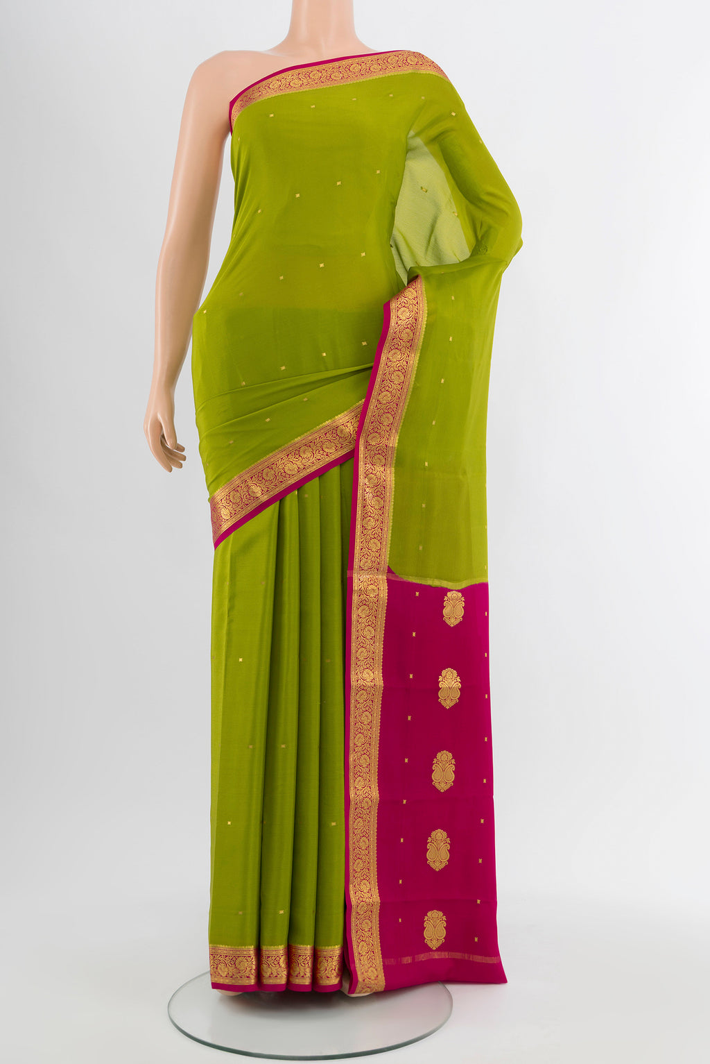 Light Green Mysore Crepe Saree with Plain Body and Silk Border.  displayed on a mannequin