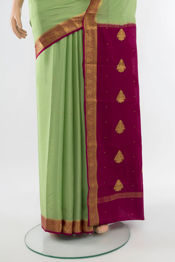 Pleats and pallu of Pista Green Mysore Crepe Saree with Plain Body and Silk Border. 