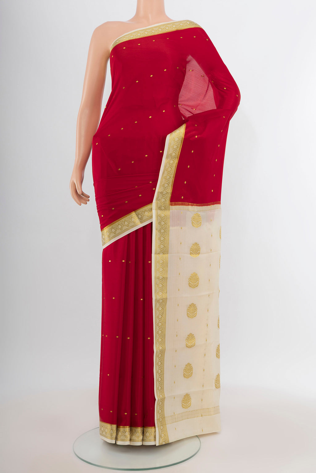 Red Mysore Crepe Saree with Zari Butta on the body and Zari Border.  displayed on a mannequin