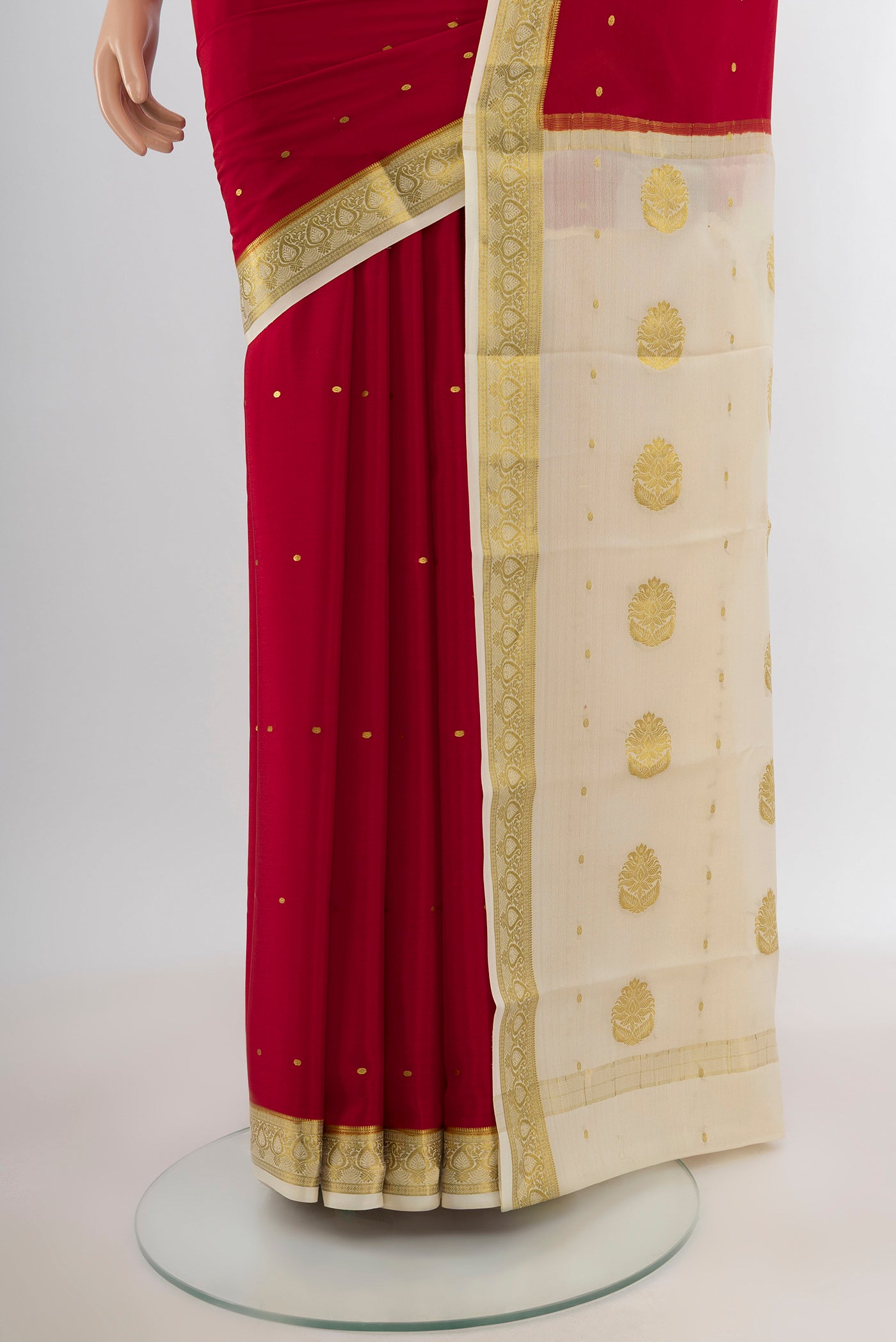Pleats and pallu of Red Mysore Crepe Saree with Zari Butta on the body and Zari Border. 