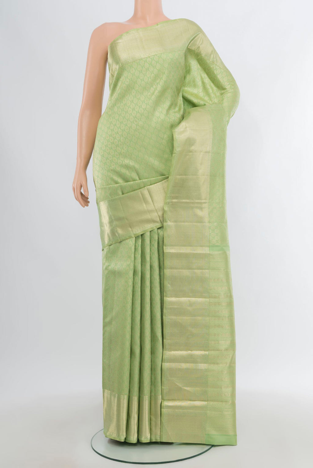 Pista Green Kanjivaram Silk Saree with Zari Brocade on the body and Zari Border.  displayed on a mannequin