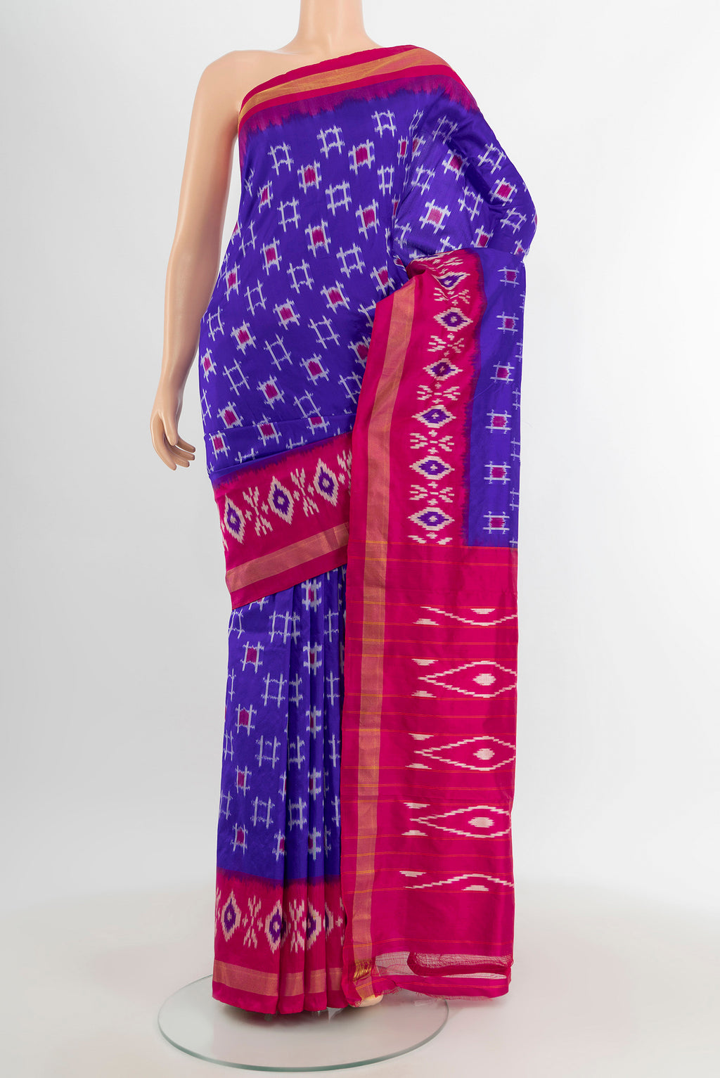 Blue Pochampally Silk Saree with Ikat design on the body and Ikat Border.  displayed on a mannequin