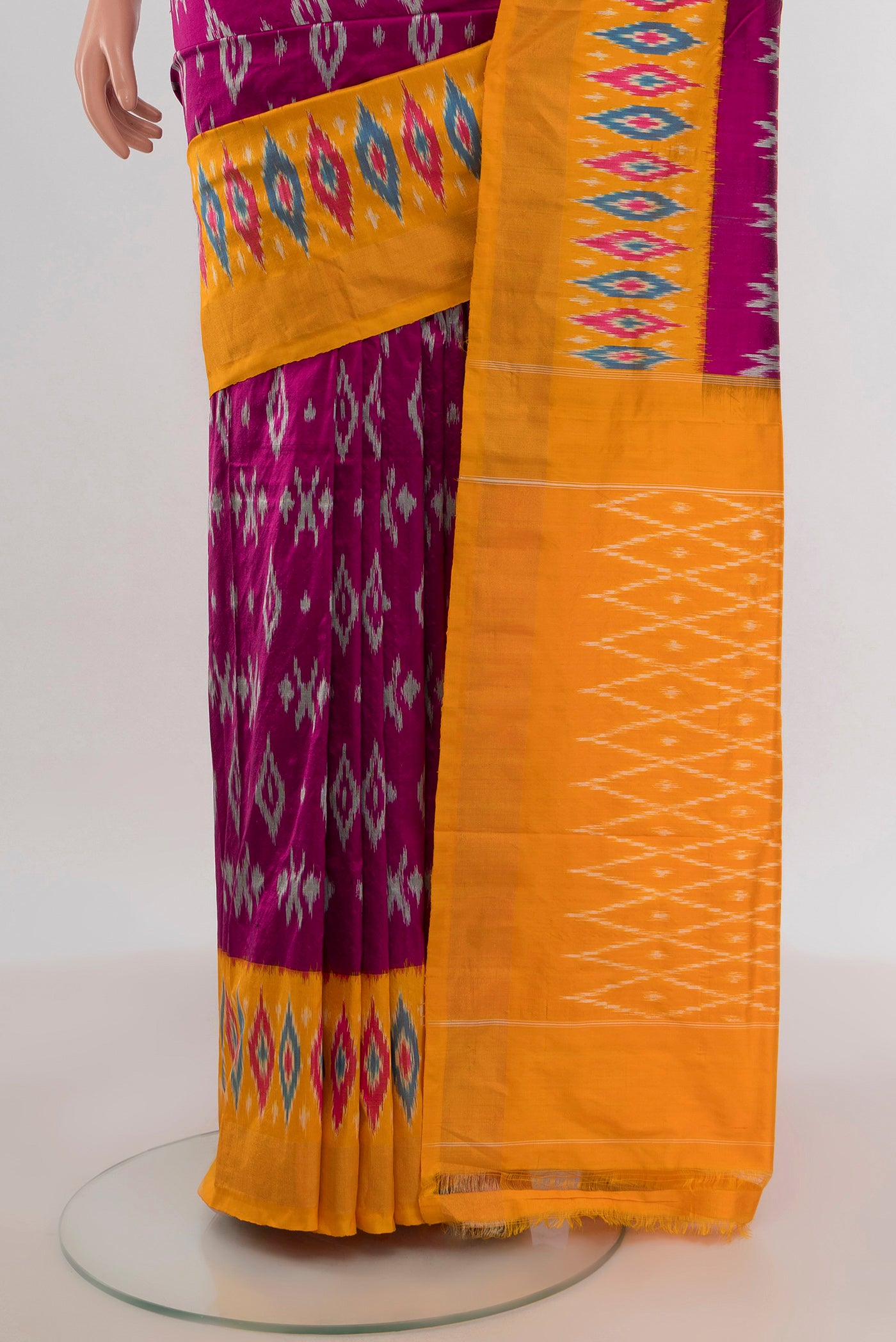 Pleats and pallu of Purple Pochampally Silk Saree with Ikat design on the body and Ikat Border. 