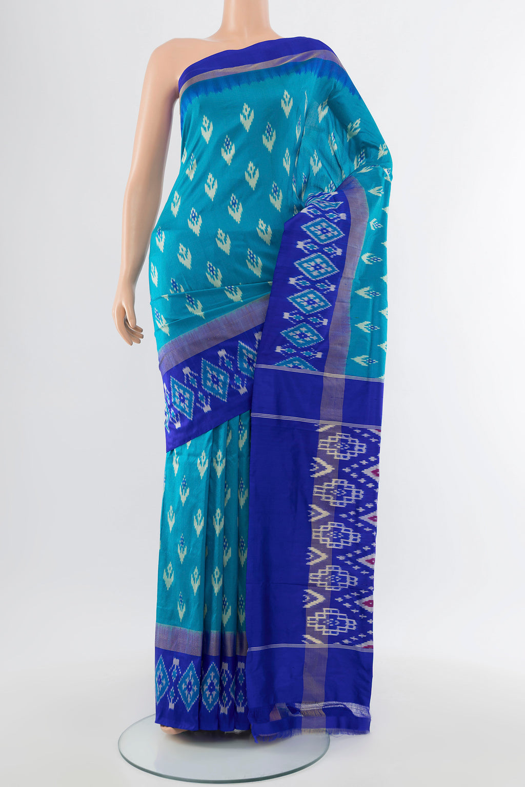 Pure Silk Pure Zari Light Blue Pochampally Saree with Ikat Print on the body and Silk Border.  displayed on a mannequin