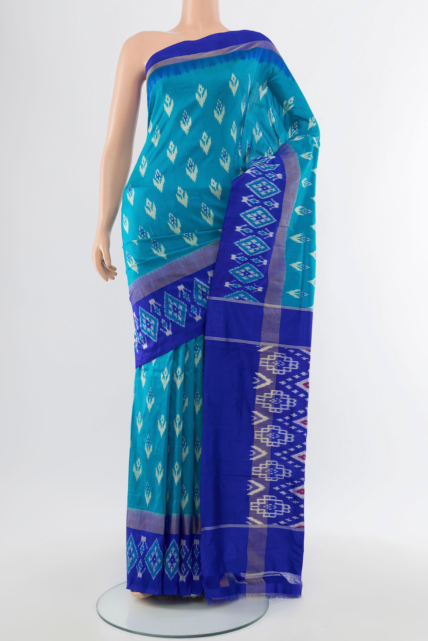 Pure Silk Pure Zari Light Blue Pochampally Saree with Ikat Print on the body and Silk Border.  displayed on a mannequin