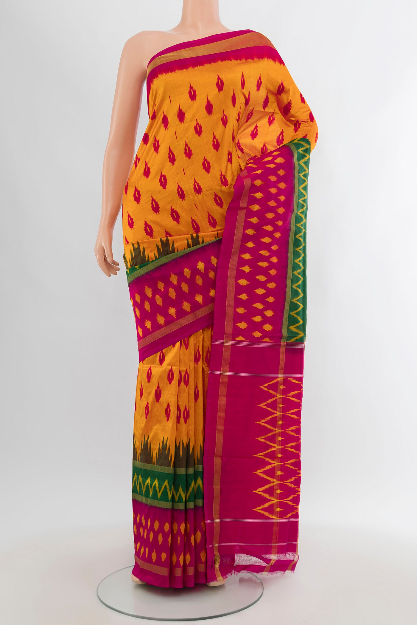 Yellow Pochampally Silk Saree with Pure Ikat on the body and Ikat Border.  displayed on a mannequin