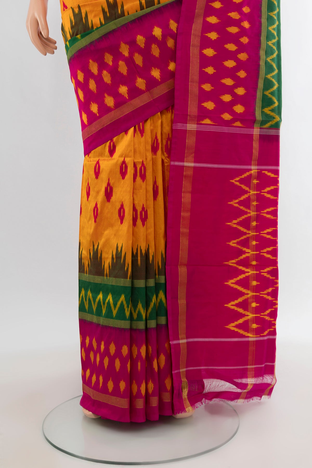 Pleats and pallu of Yellow Pochampally Silk Saree with Pure Ikat on the body and Ikat Border. 