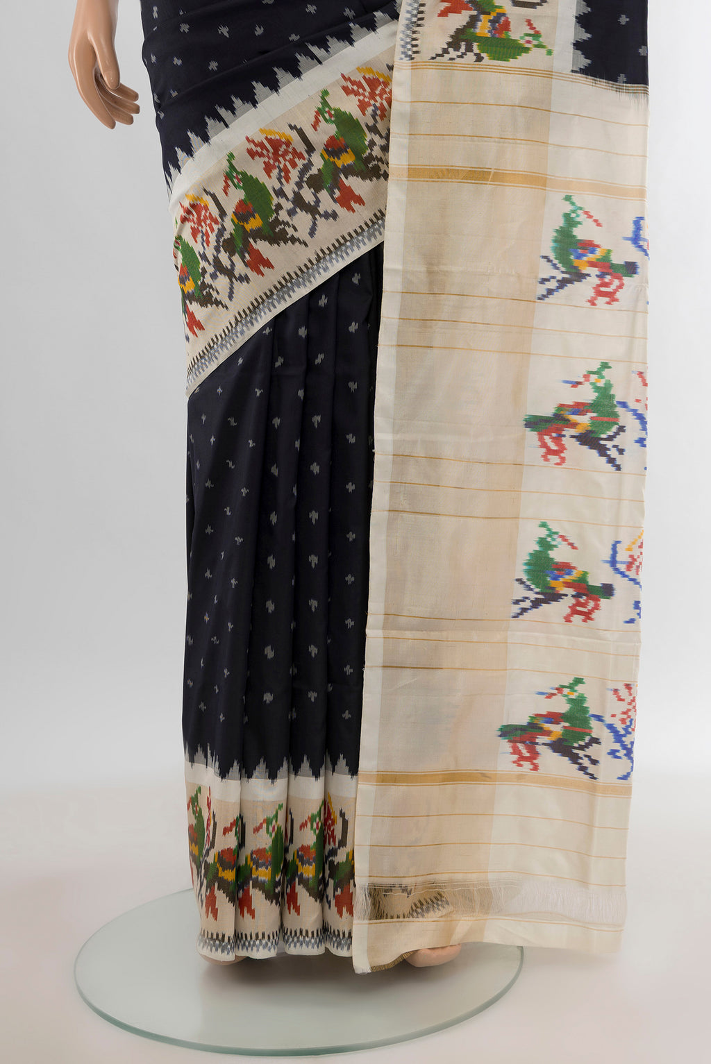 Pleats and pallu of Black Pochampally Silk Saree with Ikat design on the body and Ikat Border. 