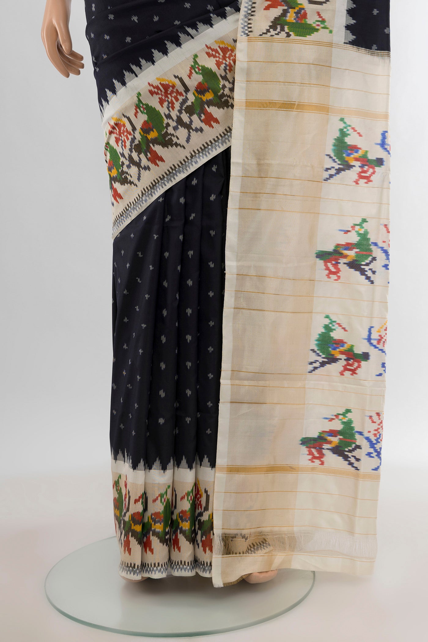 Pleats and pallu of Black Pochampally Silk Saree with Ikat design on the body and Ikat Border. 
