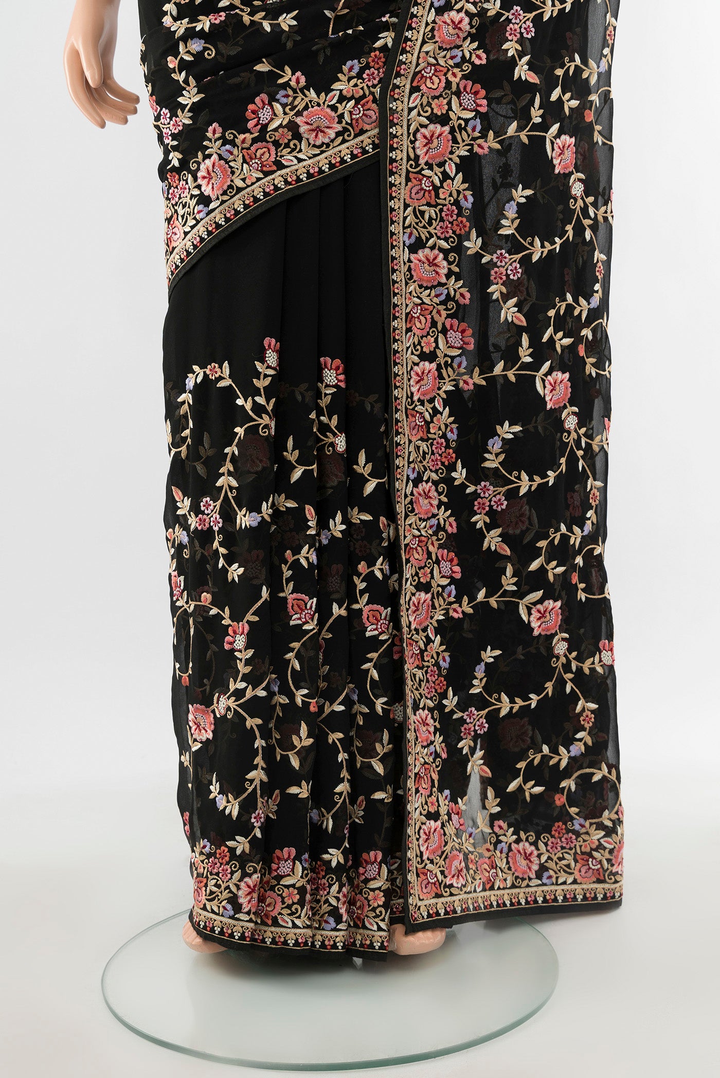 Pleats and pallu of Black Embroidery Net Saree with Embroidery on the body and Embroidery Border. 