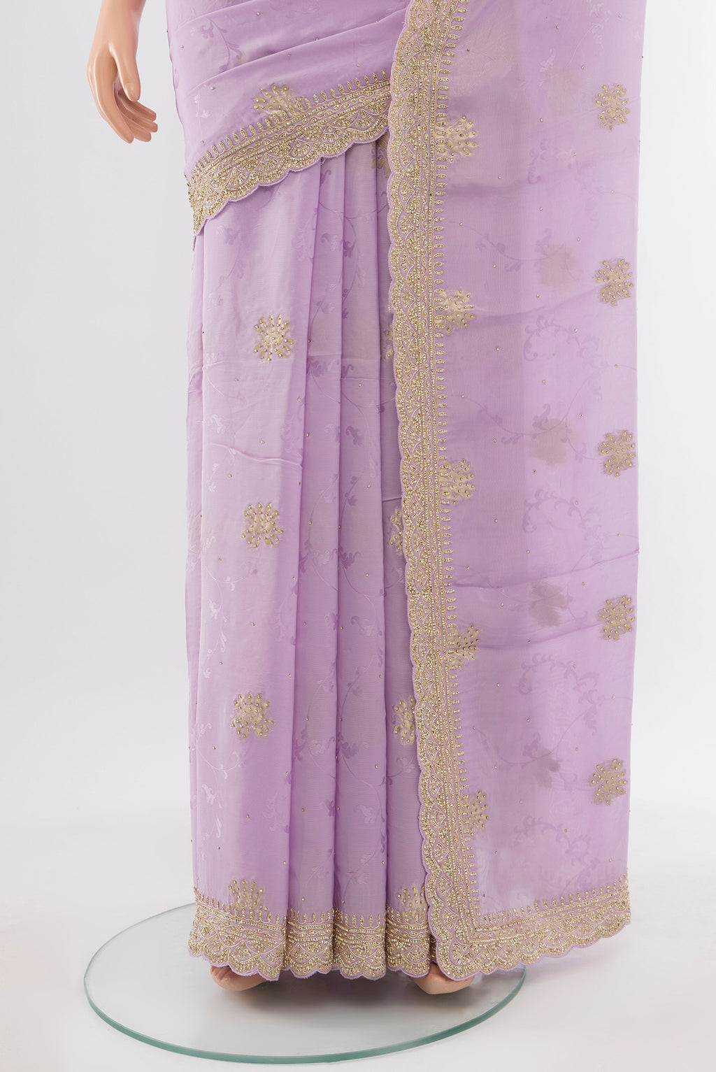 Pleats and pallu of Violet Embroidery Net Saree with Embroidery on the body and Silk Border. 