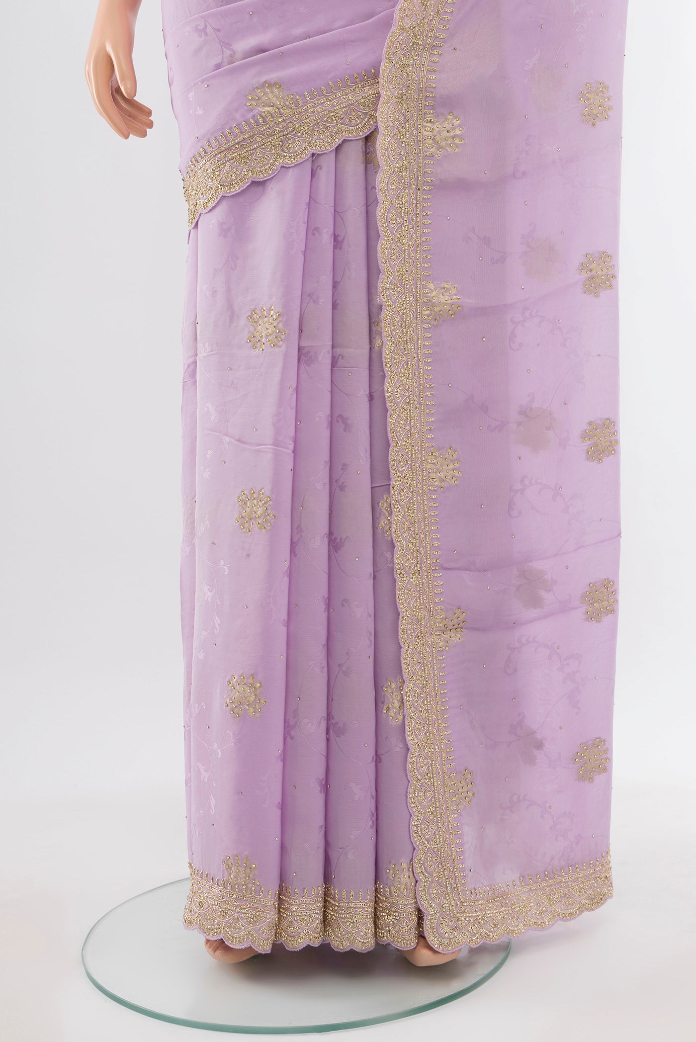 Pleats and pallu of Violet Embroidery Net Saree with Embroidery on the body and Silk Border. 