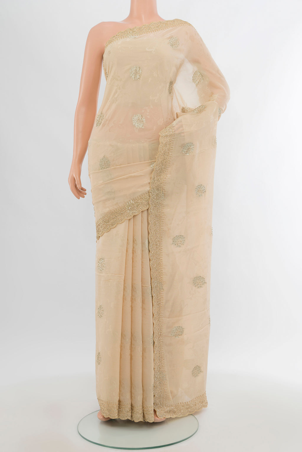 Cream Blended Art Silk Saree with Embroidery on the body and Fancy Border.  displayed on a mannequin