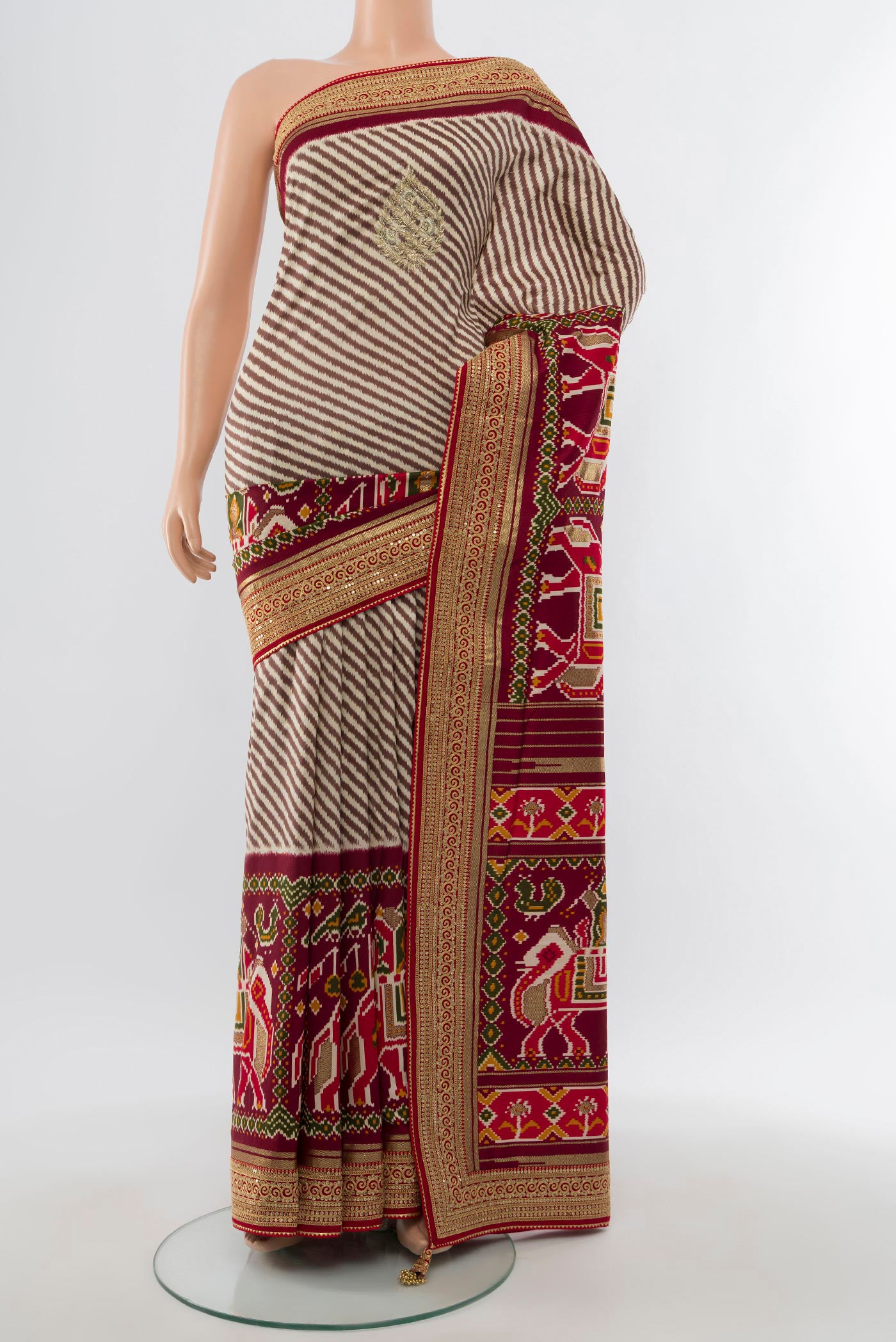 Multi Color Art Silk Saree with Embroidery on the body and Embroidery Border.  displayed on a mannequin
