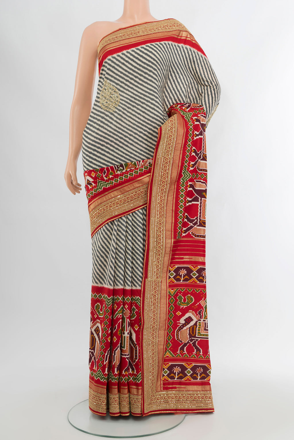 Off White Art Silk Saree with Embroidery on the body and Zari Border.  displayed on a mannequin