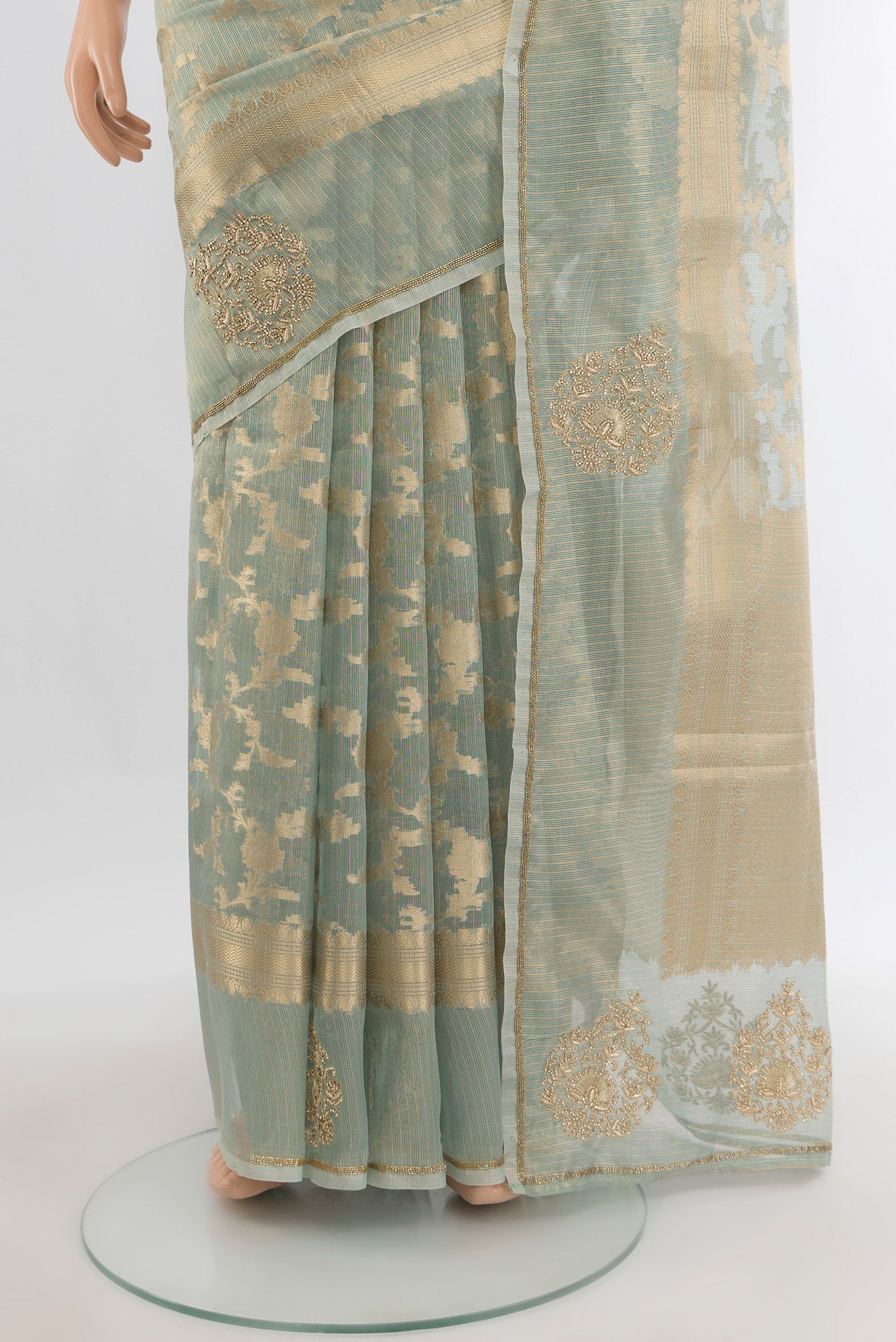 Pleats and pallu of Light Green Embroidery Net Saree with Embroidery on the body and Fancy Border. 