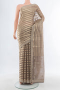 Golden Art Silk Saree with Stripes on the body and Embroidery Border.  displayed on a mannequin